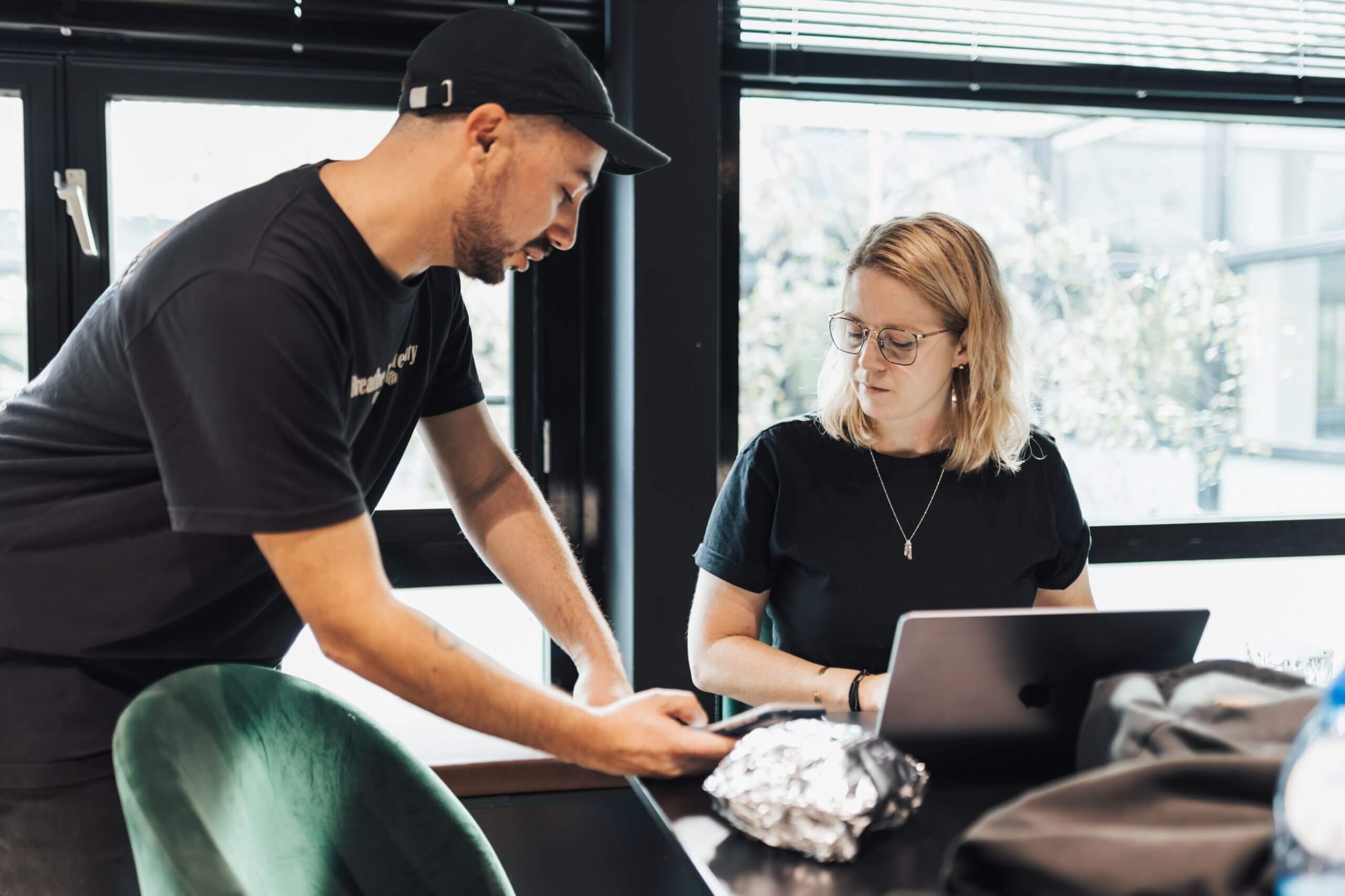a person running an in-person facilitated user testing session.