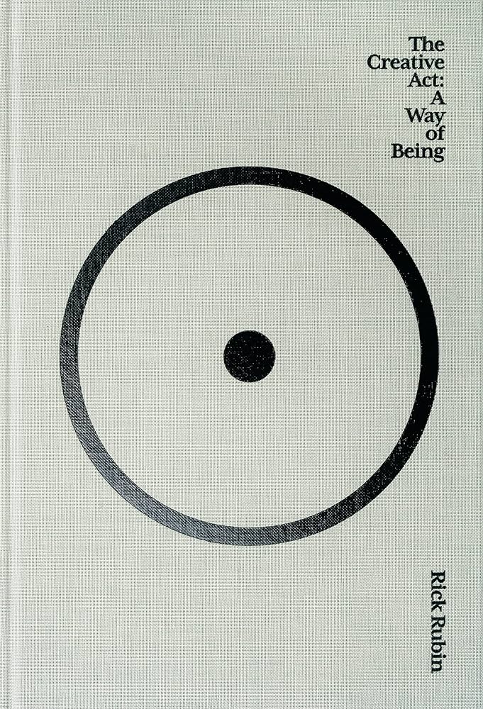 Cover of The Creative Act: A Way of Being by Rick Rubin. The design features a large black circle with a smaller black dot in the center on a light gray background, with the title and authors name in black text.
